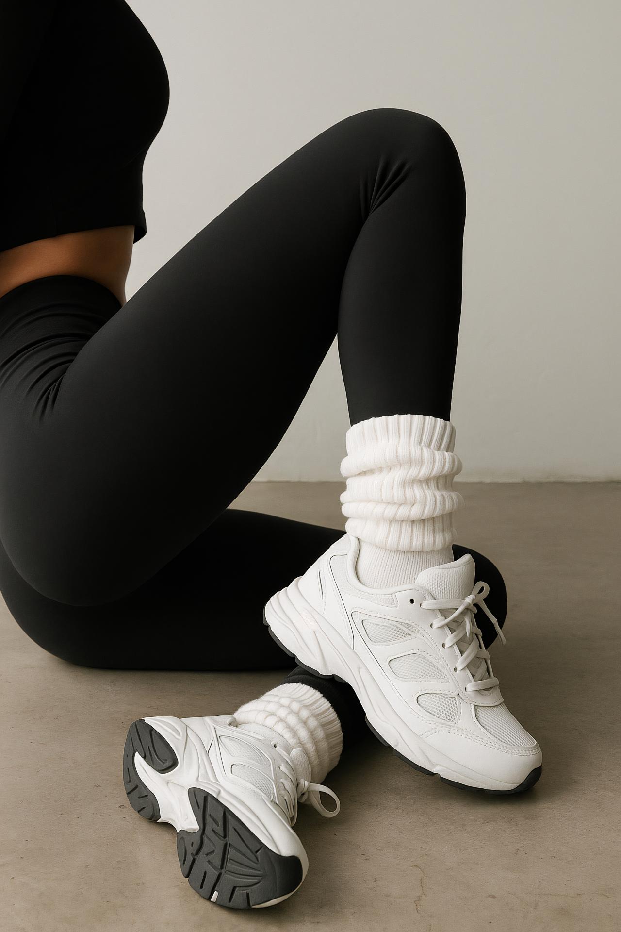 Girl in grey active leggings balancing on one foot