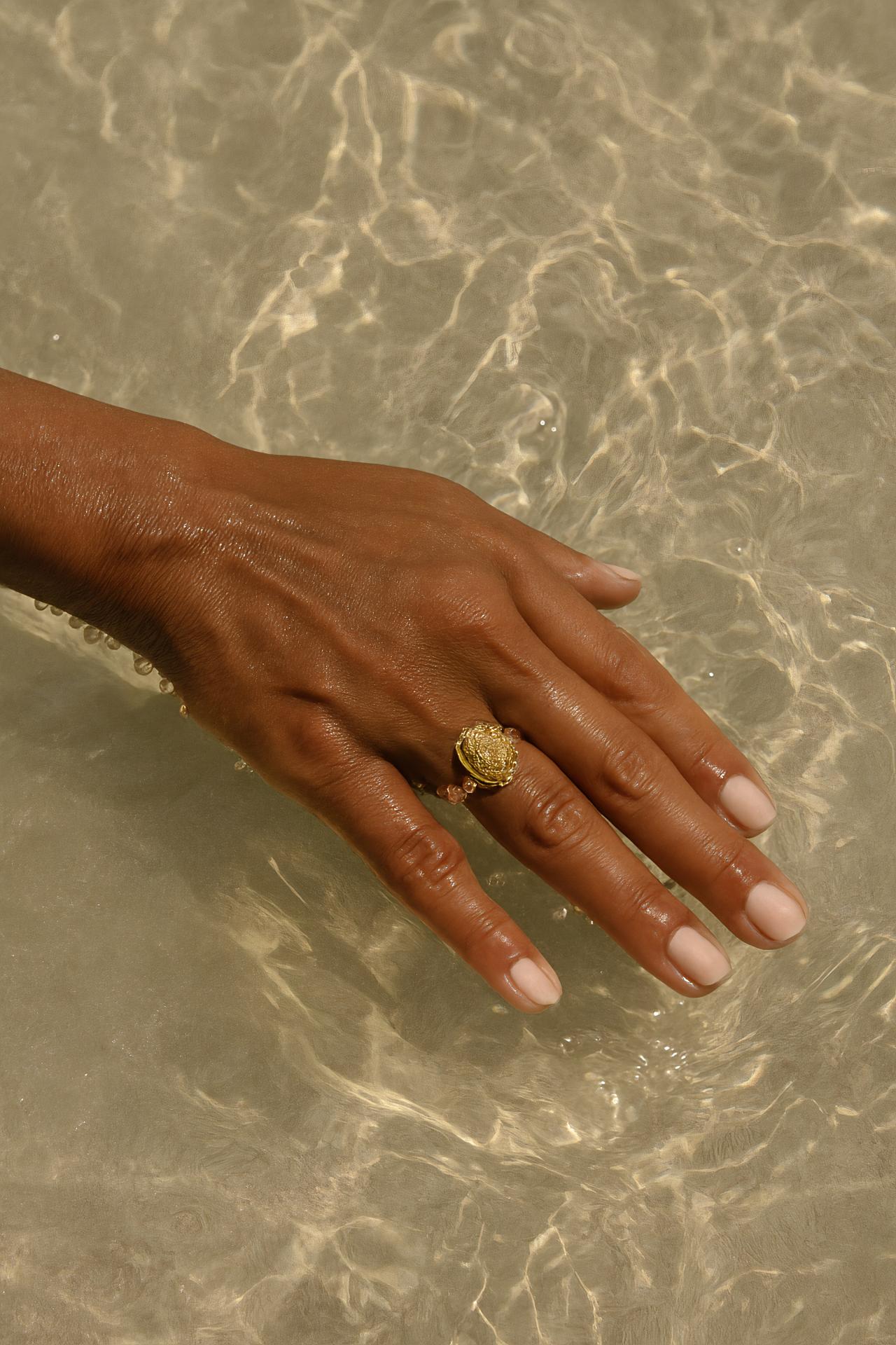 Hand with rings, nail polish, wedding and engagement ring, body jewelry