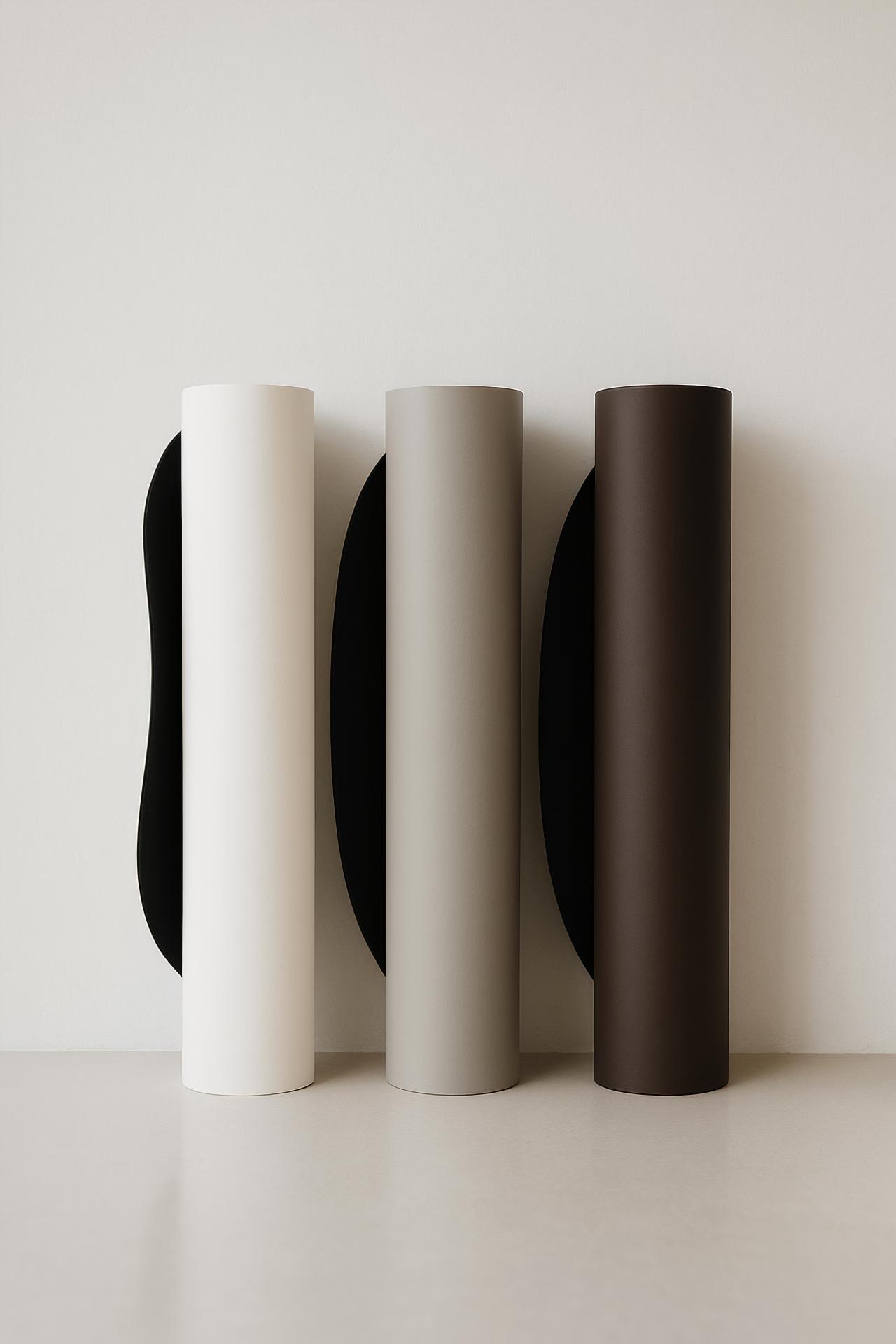 Grey coffee table with cylinder vase and coffee beans