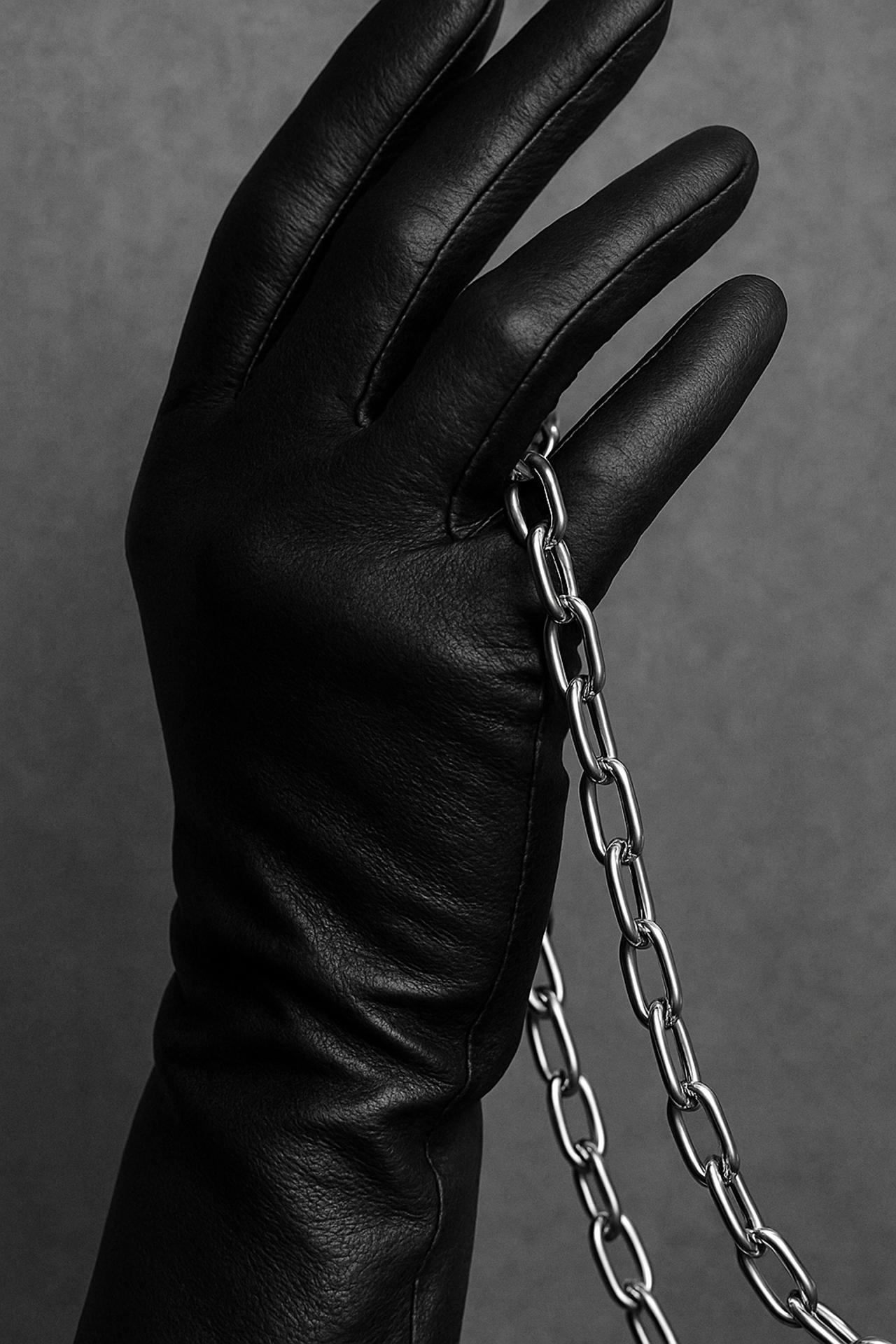 Silver chain, leather gloves, monochrome fashion accessories