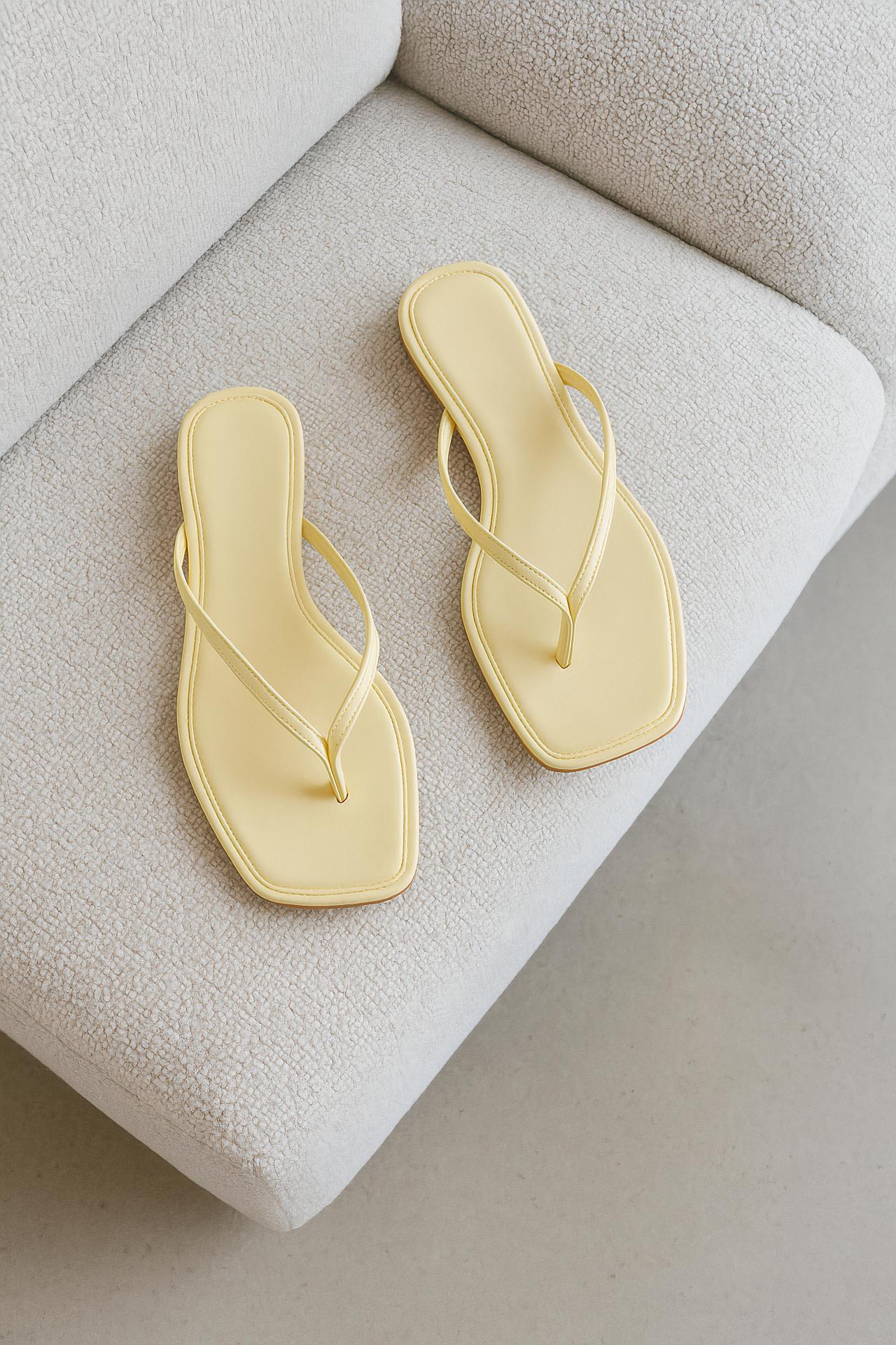 Leather flip-flops, natural material background, stylish sandals
