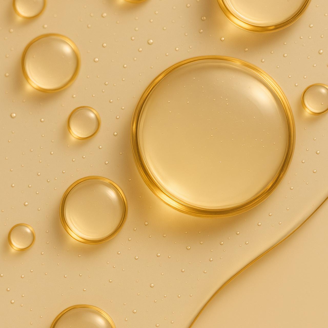 Yellow liquid drop with bubbles, high-resolution stock photo