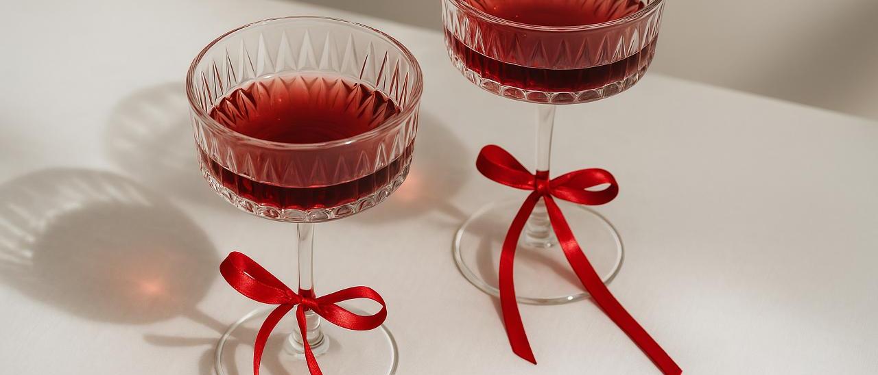 Red champagne stemware and glassware on table