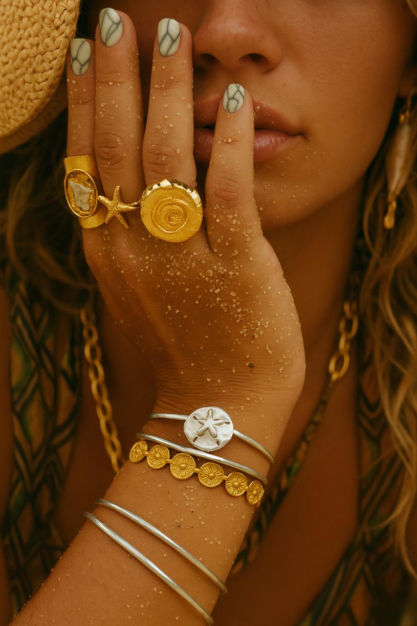 Fashionable girl with jewellery, necklace, bracelet, earrings, rings, and gemstones