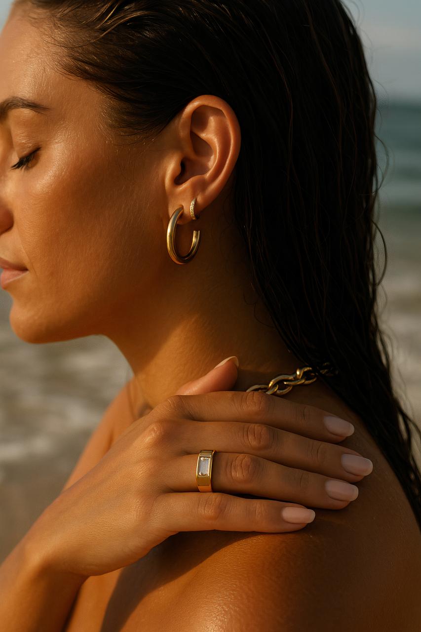Fashion model with jewellery, earrings, gemstone necklace, body piercings
