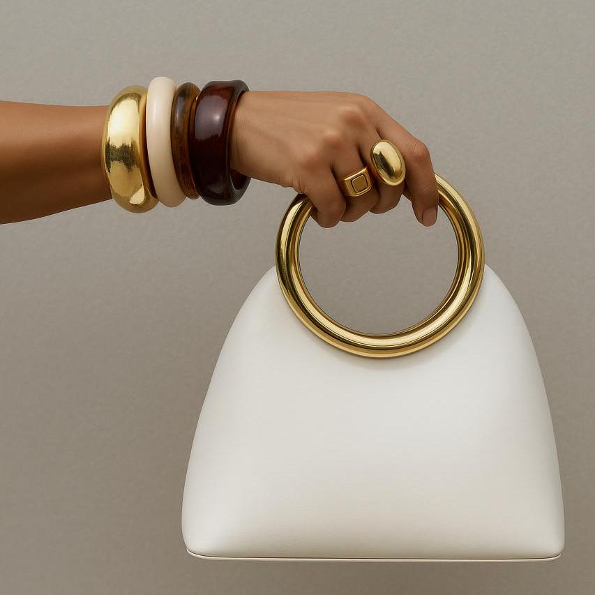 Leather shoulder bag with strap and handle