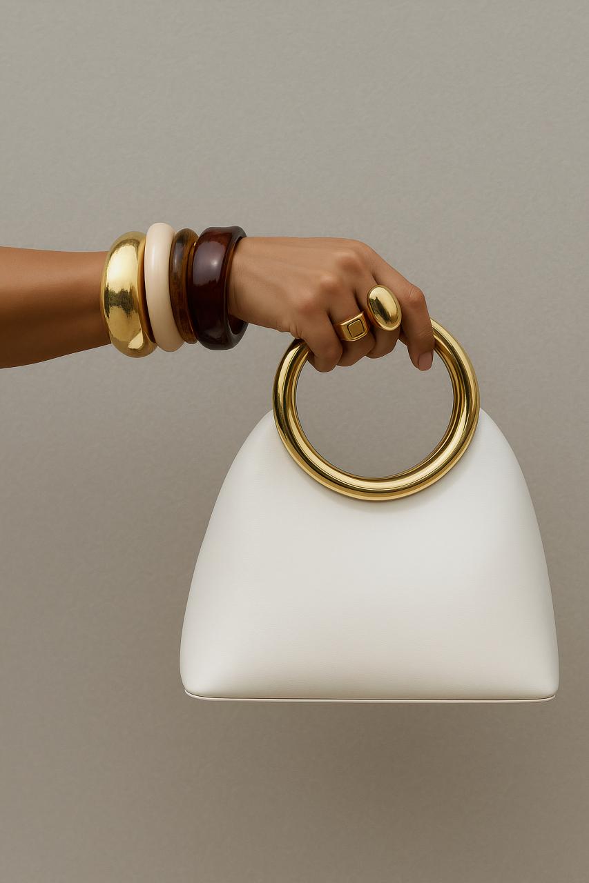 Leather shoulder bag with strap and handle