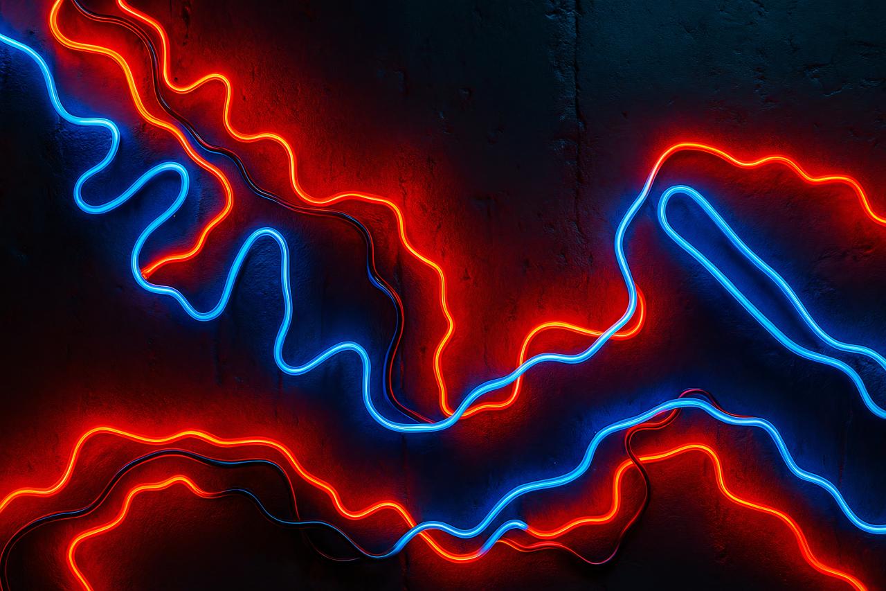 Neon lights in blue, red, and orange at night