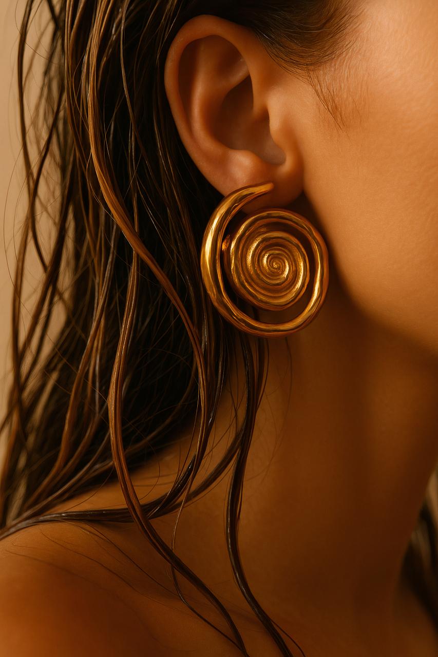 Spiral metal earrings in copper, bronze, and brass
