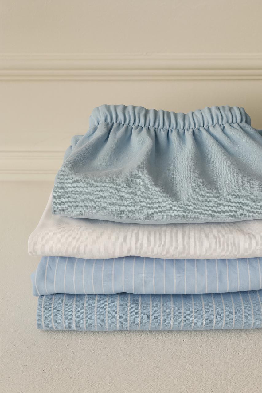 Turquoise and blue linen bed sheets and textile collection