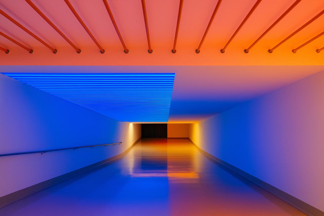 Subway station architecture with colorful reflections and symmetry