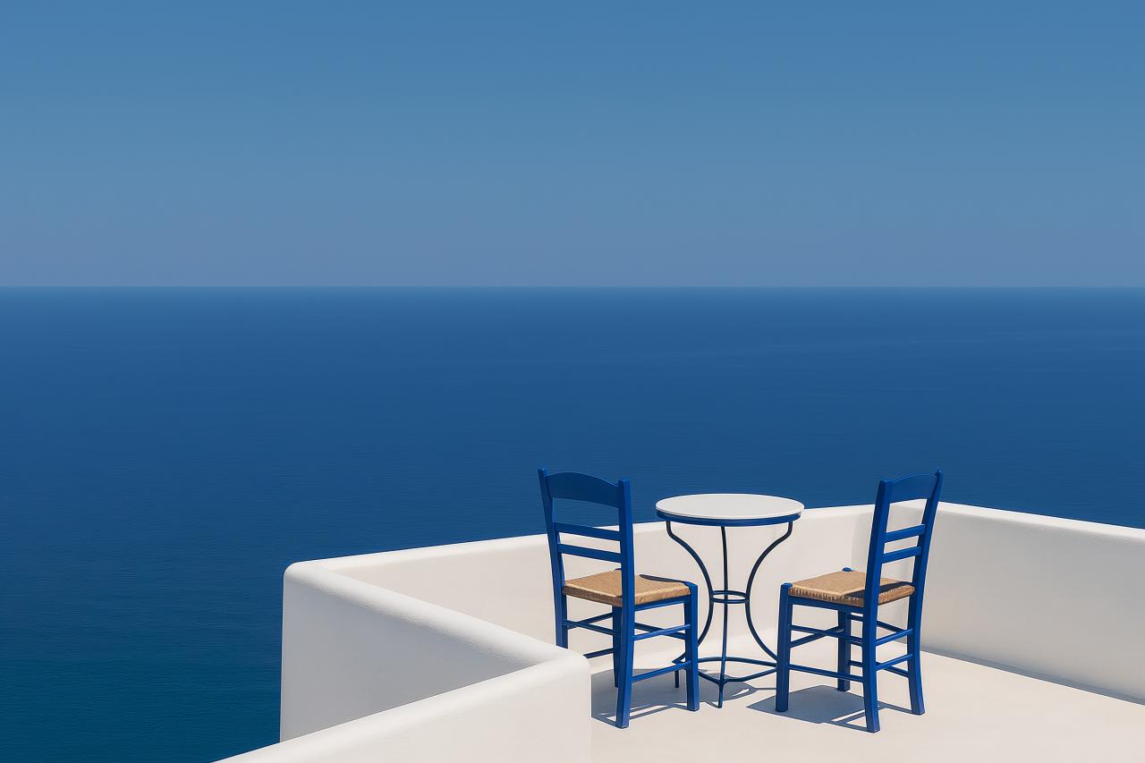 Coastal scene with blue sea, folding chair, table, and coffee cup