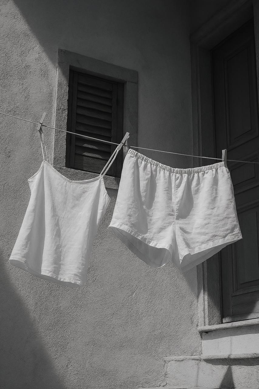 Monochrome towel, trunks, linens on display