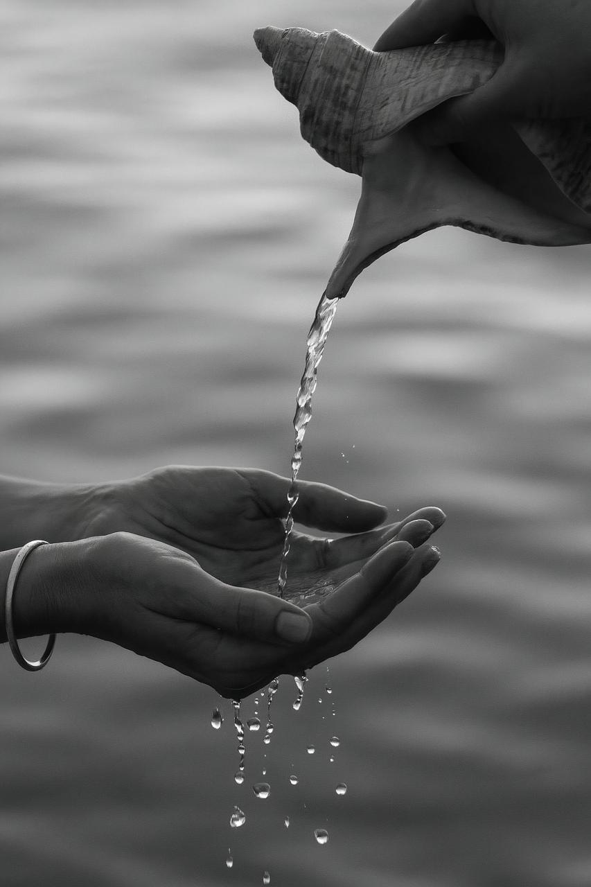 Silver liquid wave with reflection, monochrome close-up