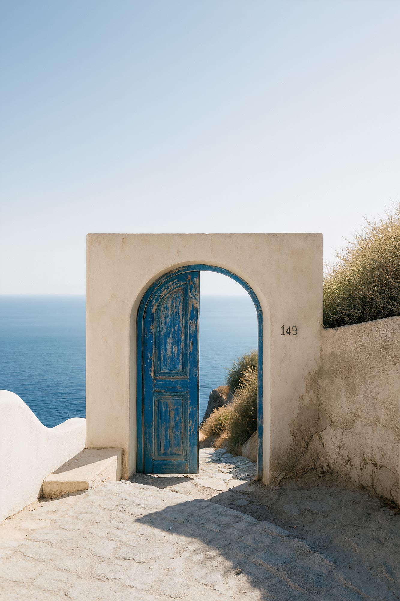 Coastal arch overlooking ocean with stairs on beach
