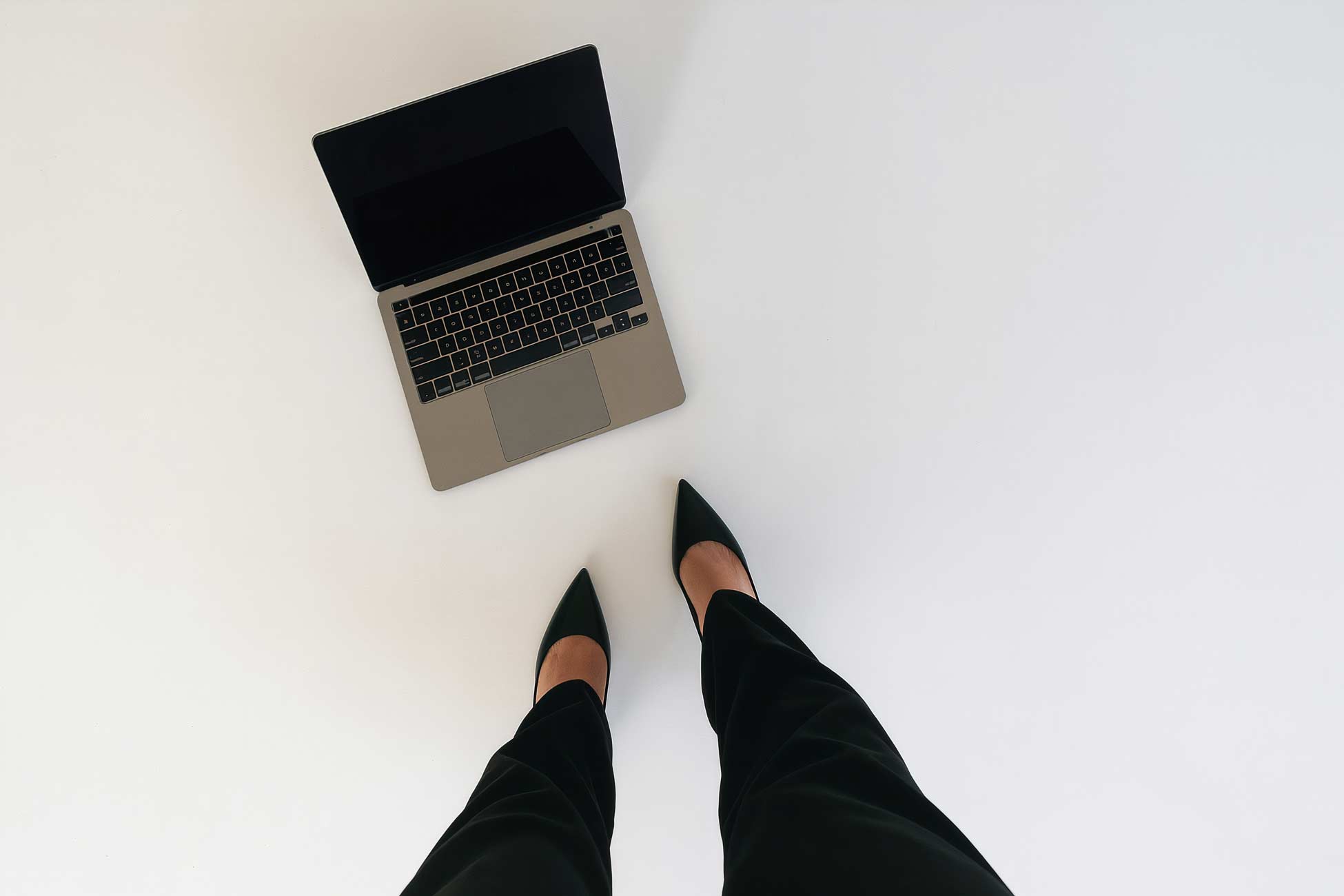 Laptop, electronic devices, and office supplies in outdoor office setting