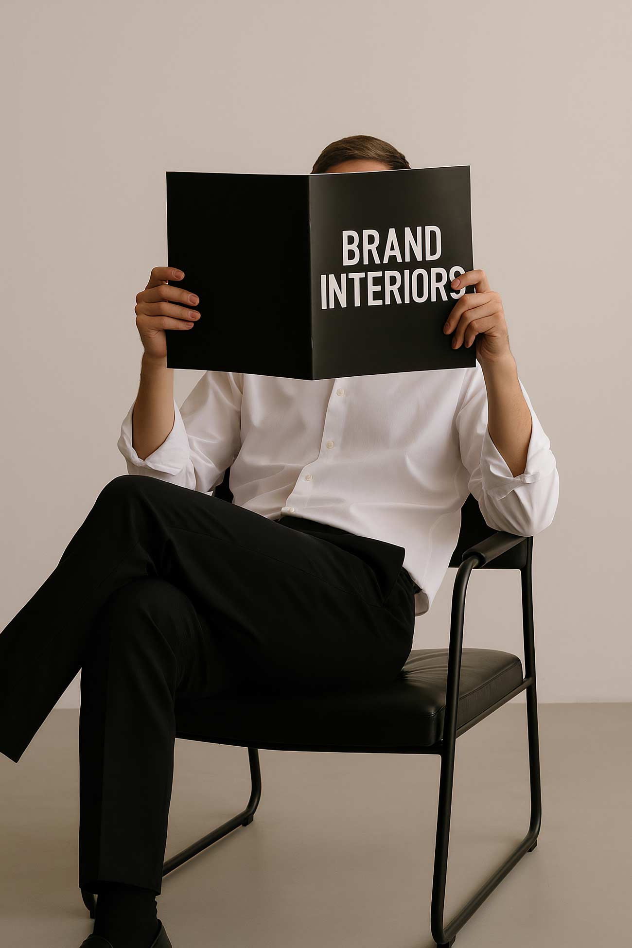 Person sitting on chair with tote bag