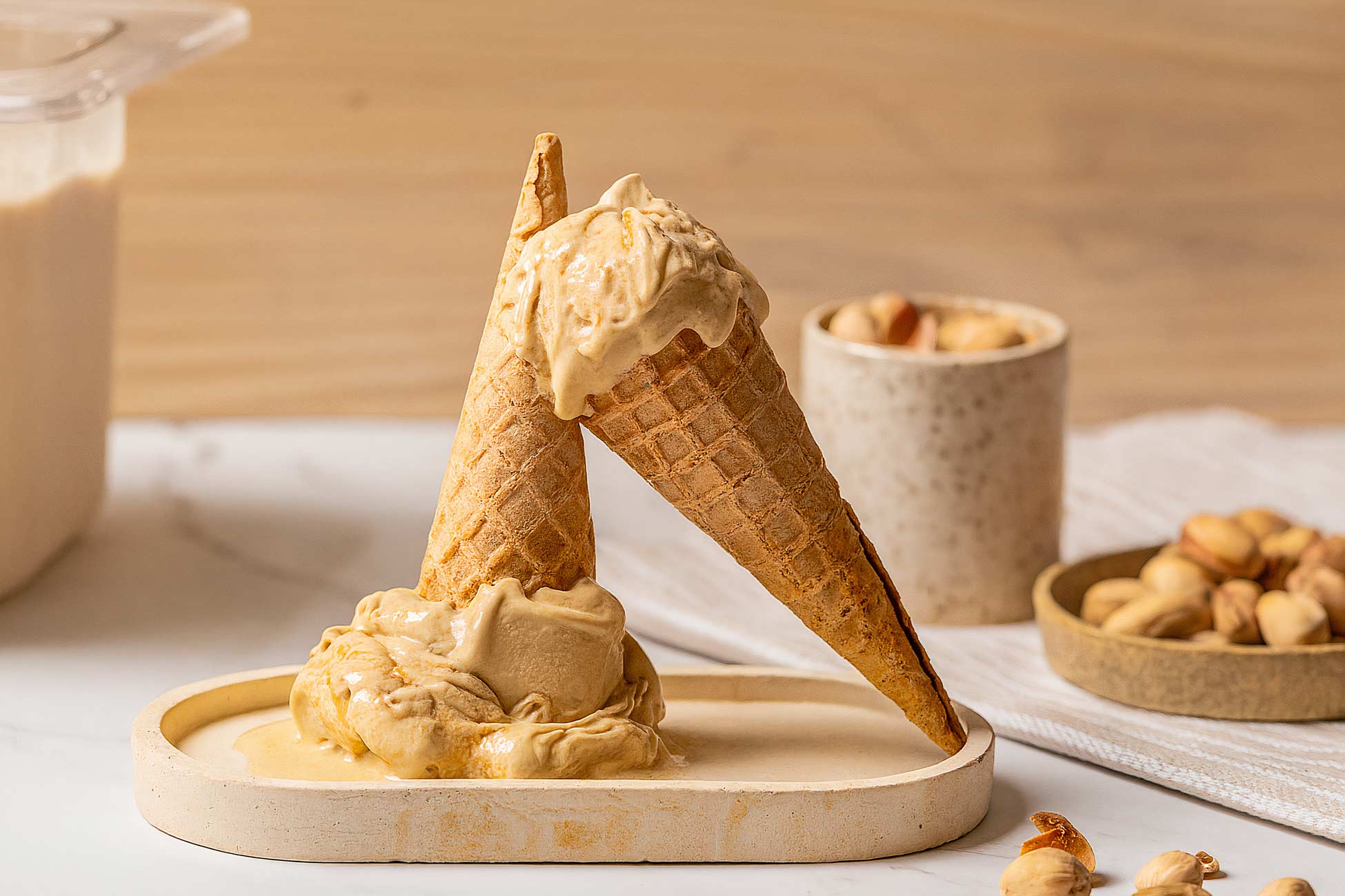 Colorful gelato cone with various flavors in waffle cone