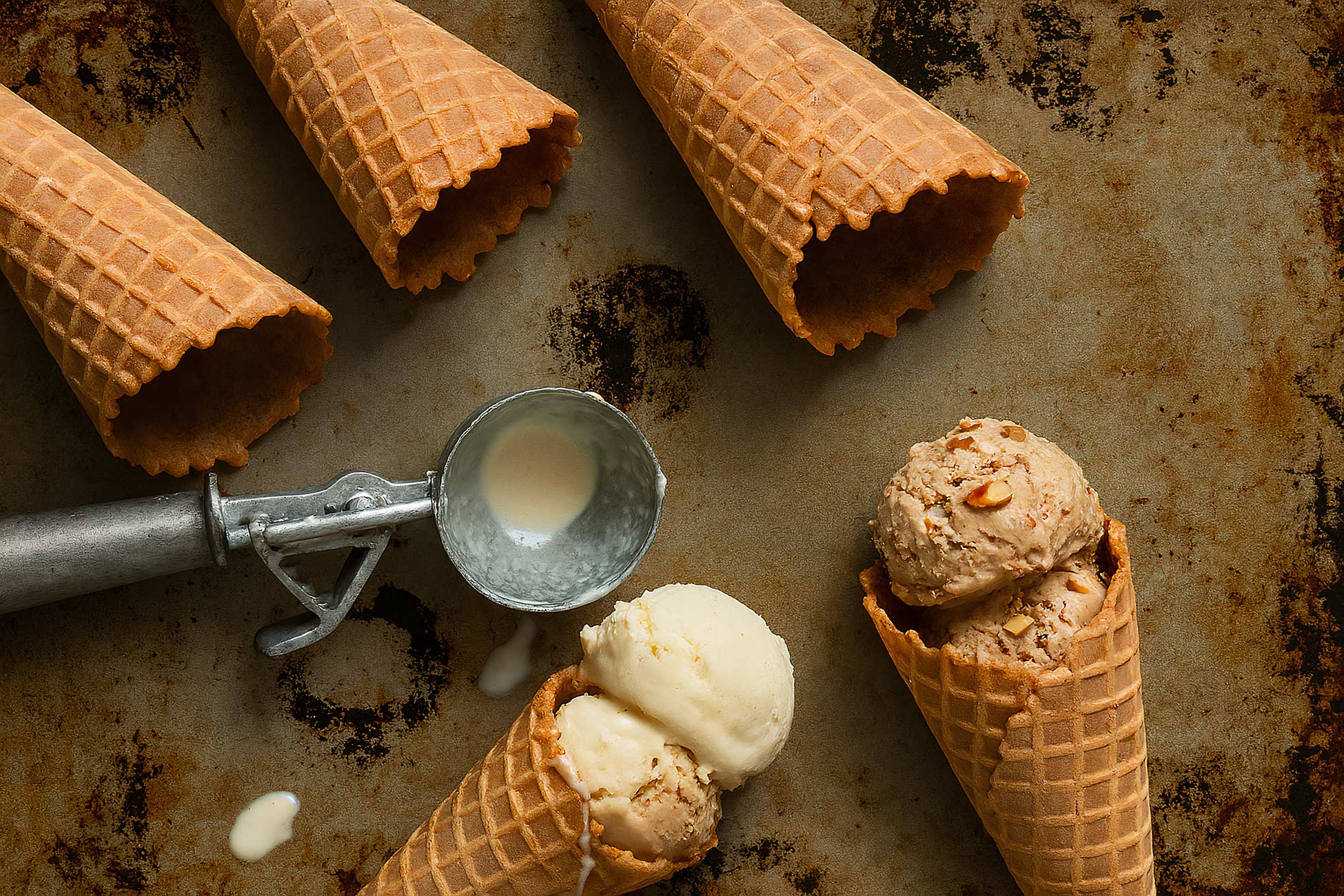 Melting ice cream cone with gelato and sorbetes
