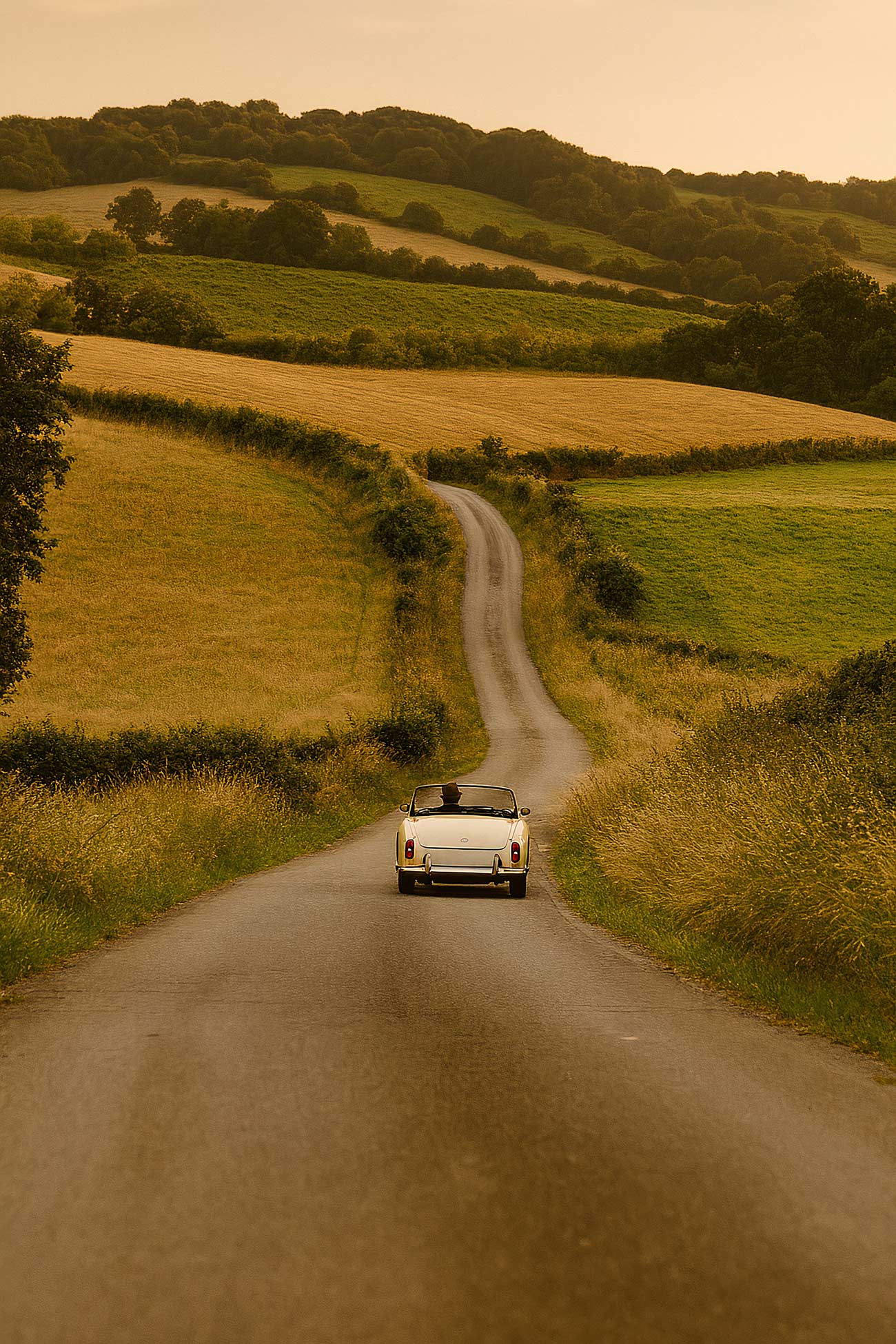 Vintage car driving on dirt road