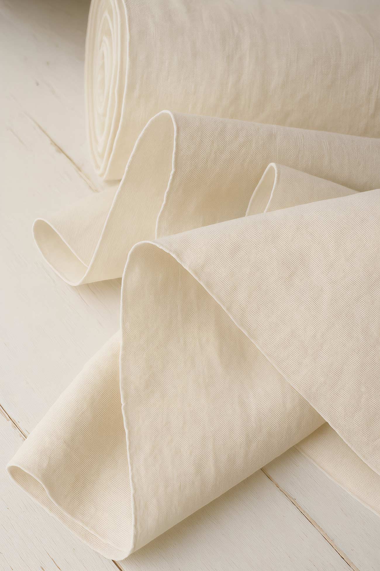 Assortment of linen towels, napkins, tablecloths, silk and tissue paper