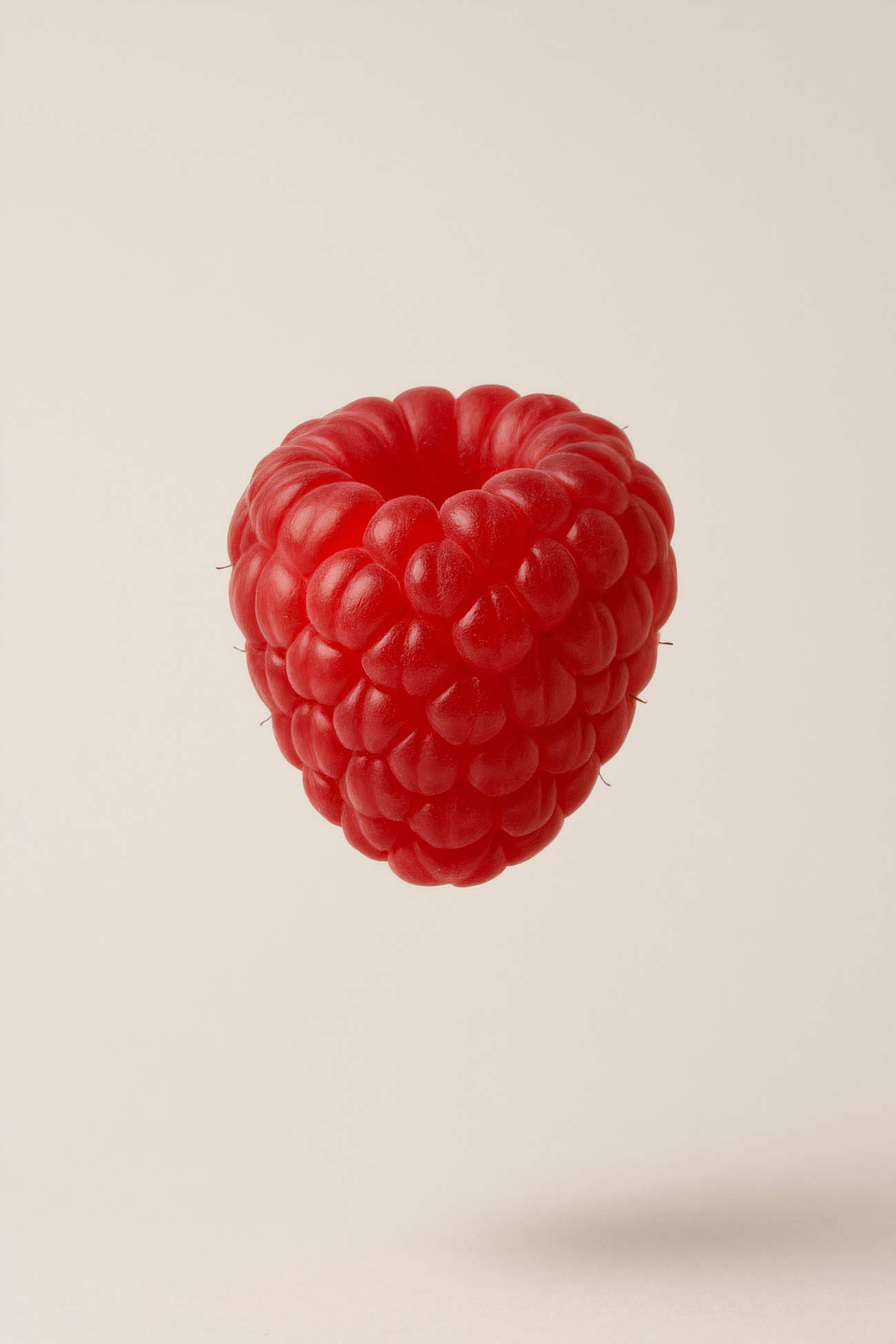 Raspberry and berry assortment on wooden surface