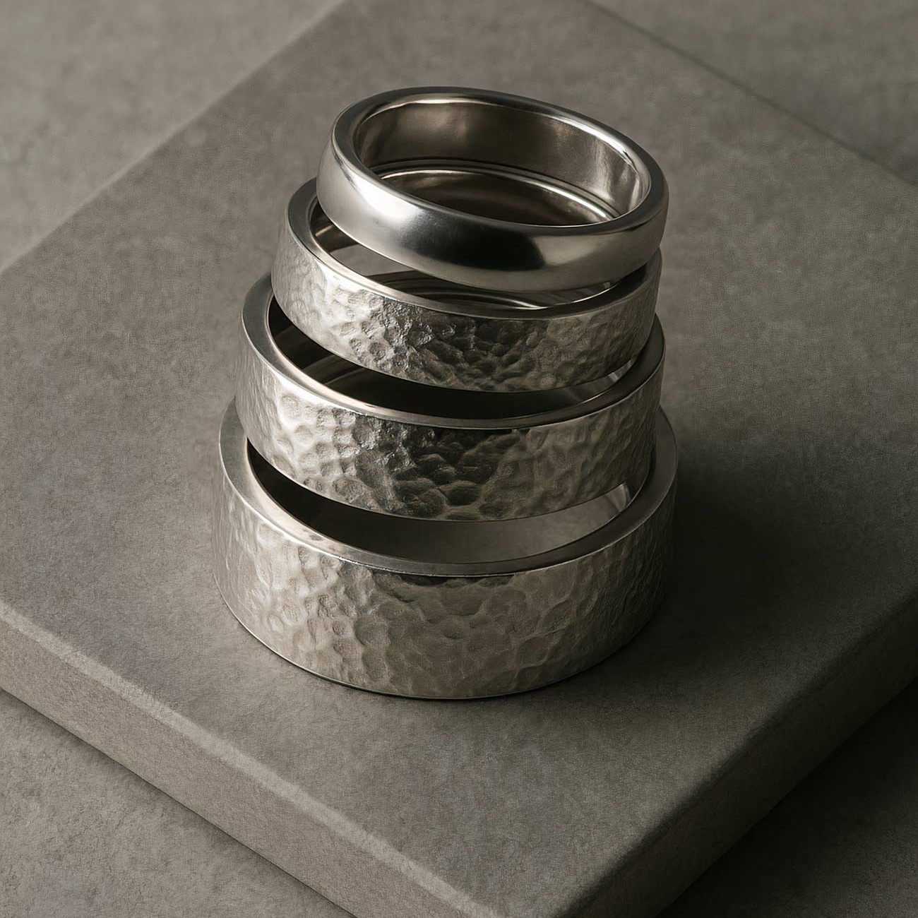Silver titanium wedding ring on display