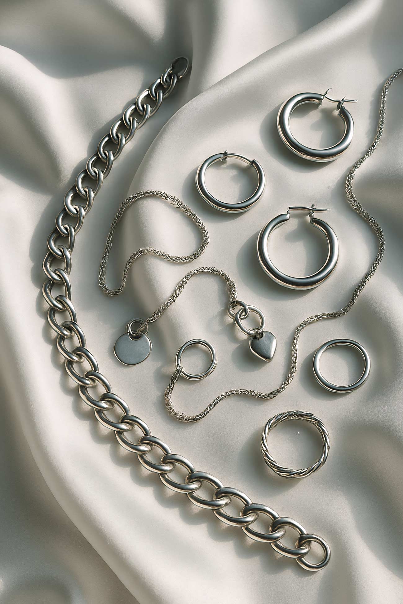 Silver chain necklace on natural material background