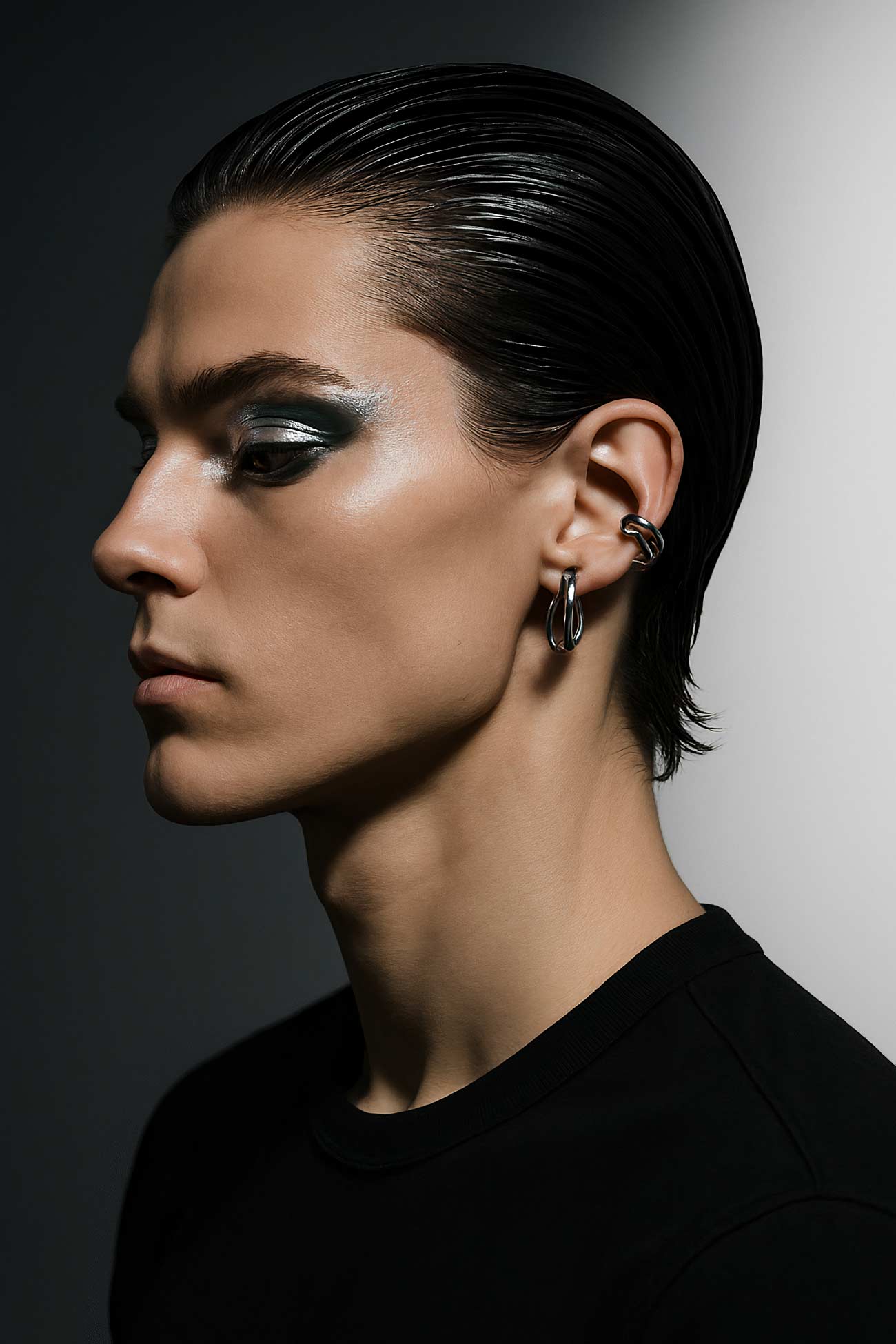 Fashion model with black hair, jewelry, elegant neck in portrait photo