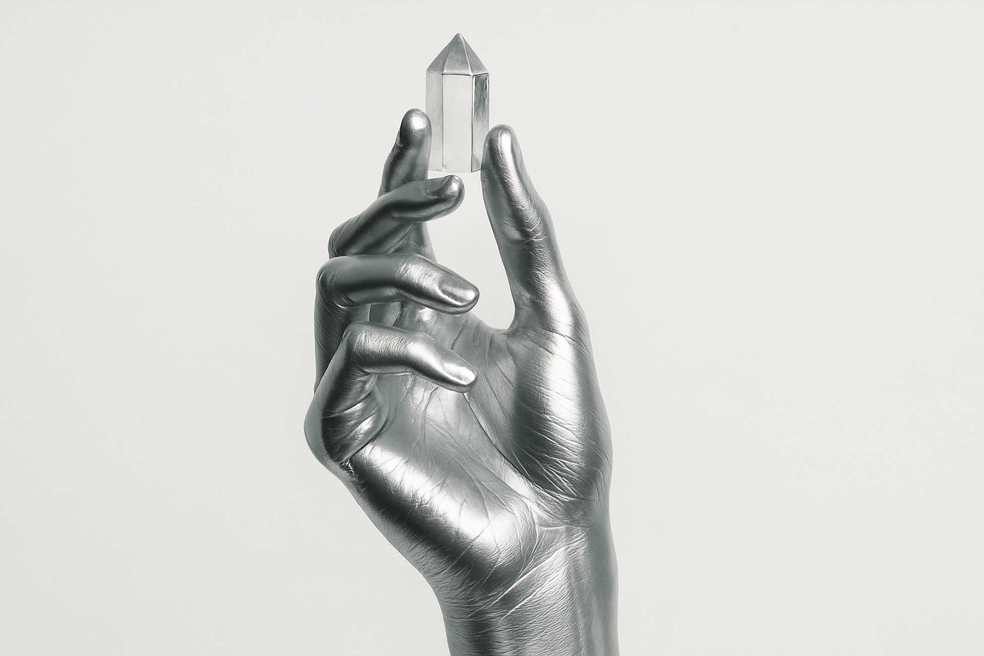Silver finger statue with detailed nail art sketch