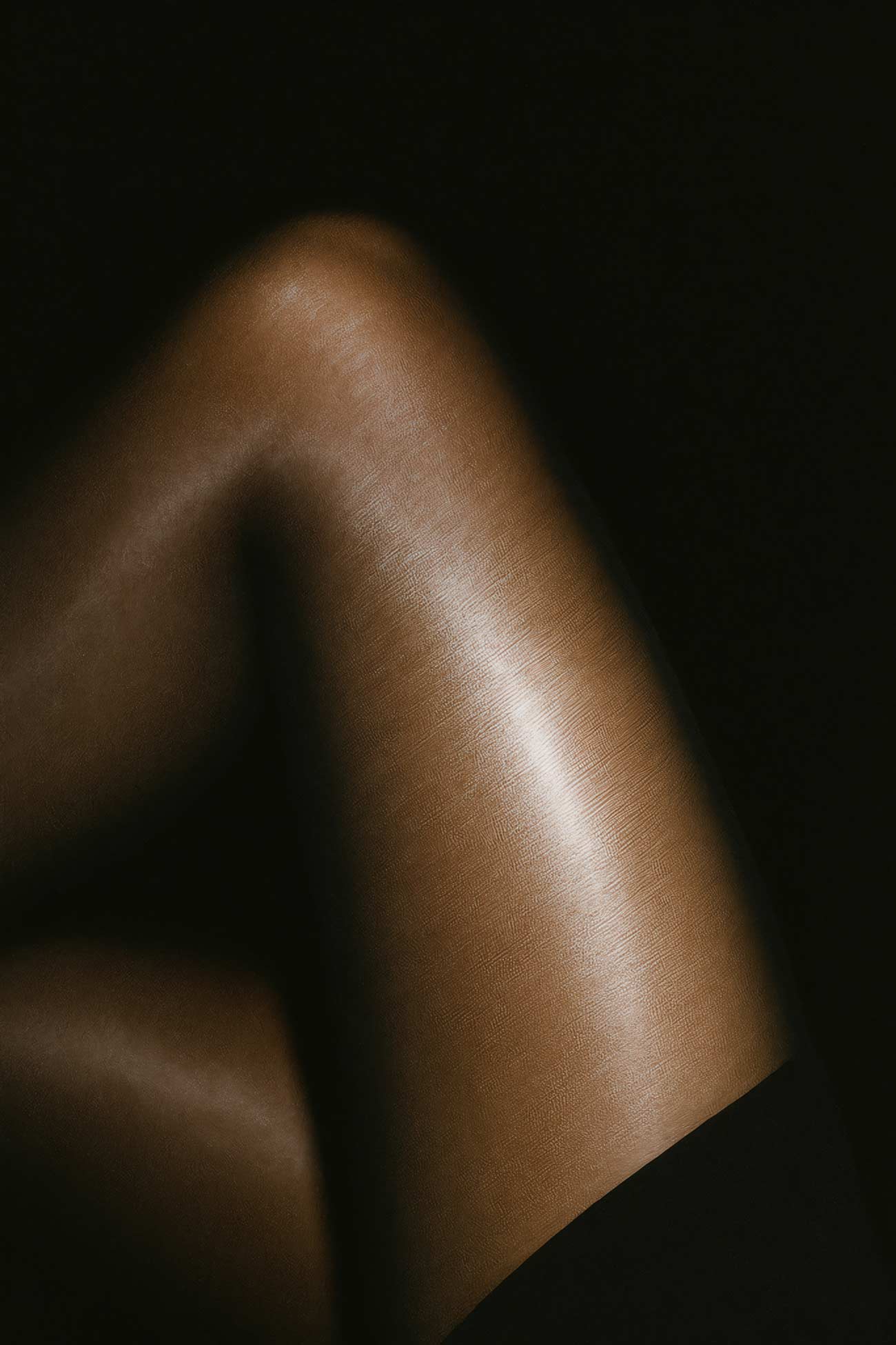 Leather thigh-high stockings on model\'s legs