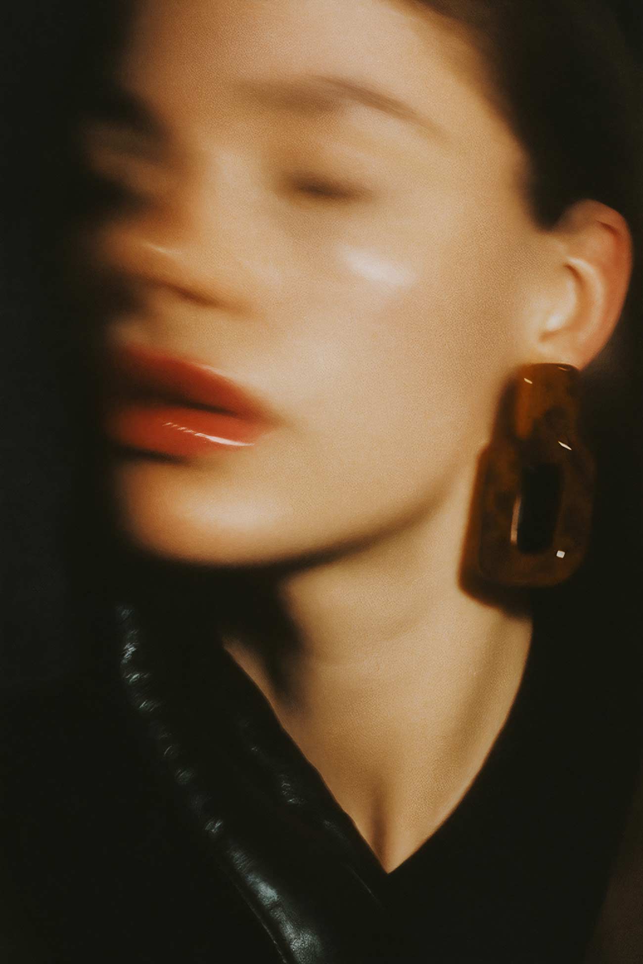 Fashion beauty girl with black hair, close-up portrait