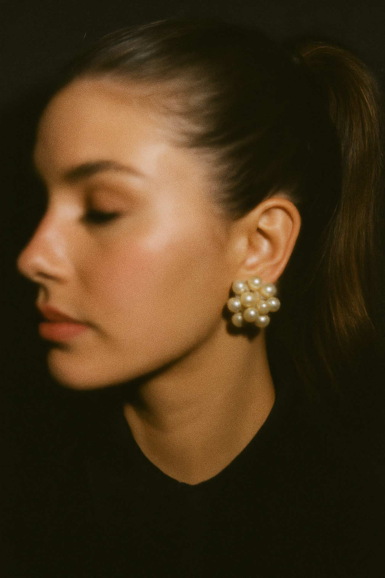 Stylish woman\'s chin, lips, eyebrow, hairstyle, earrings, pearl jewellery