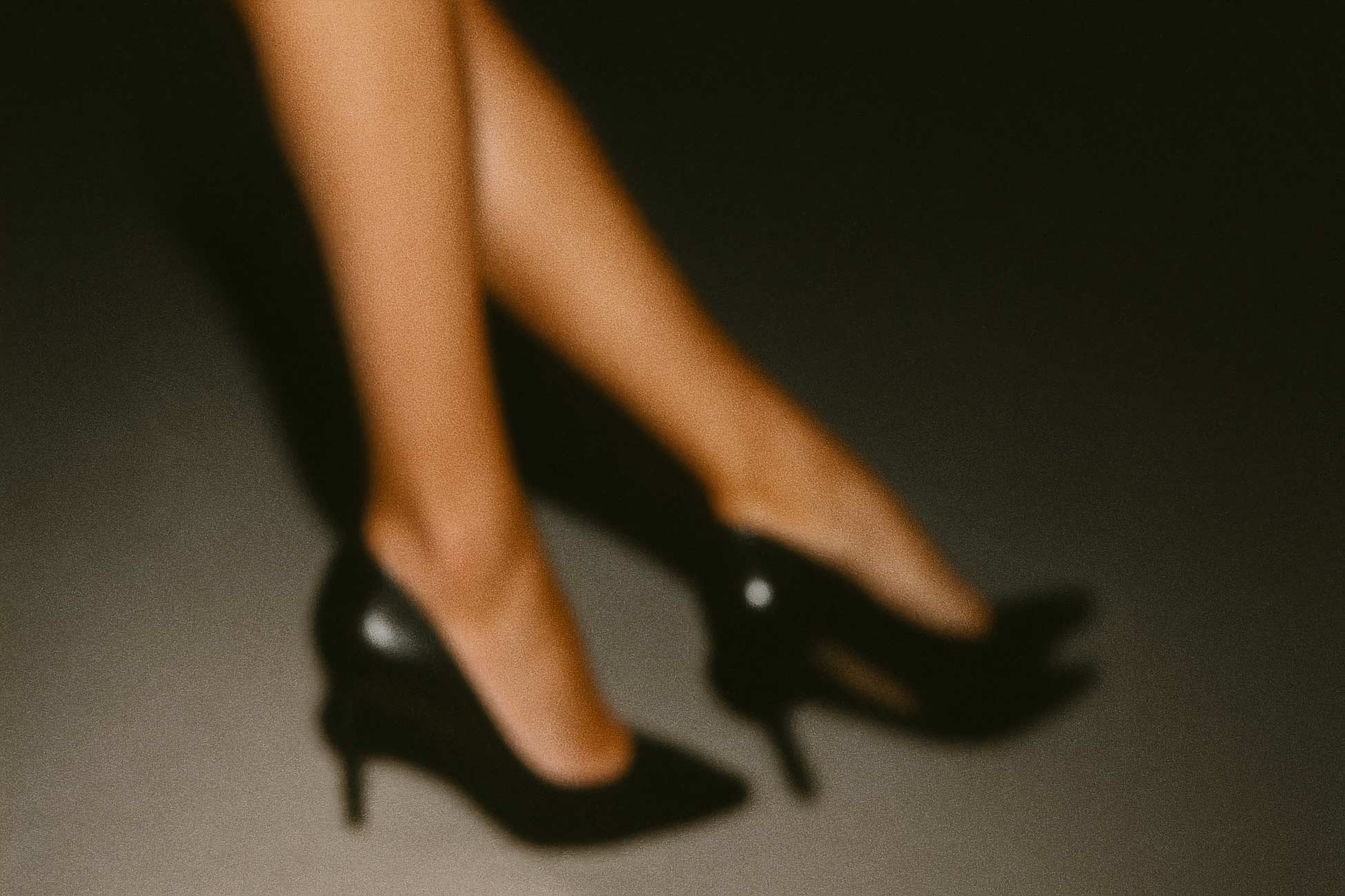 Black court shoe on foot dancing elegantly