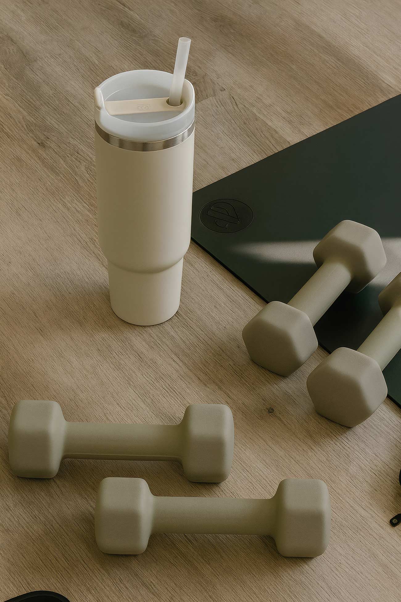 Dumbbell, cylinder, and pilates equipment in a fitness setting