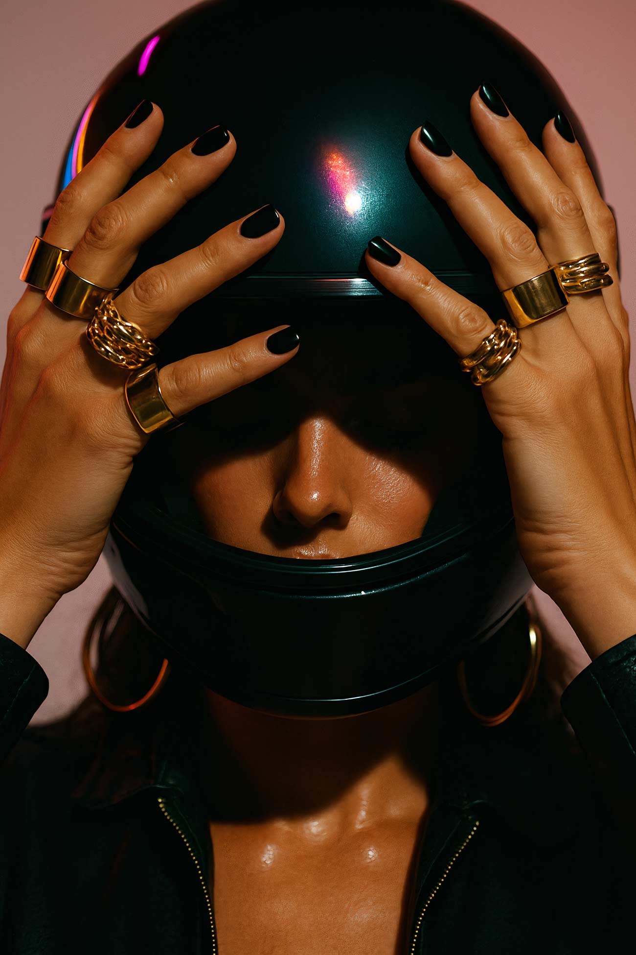 Manicured hand with nail polish, jewellery, and watch