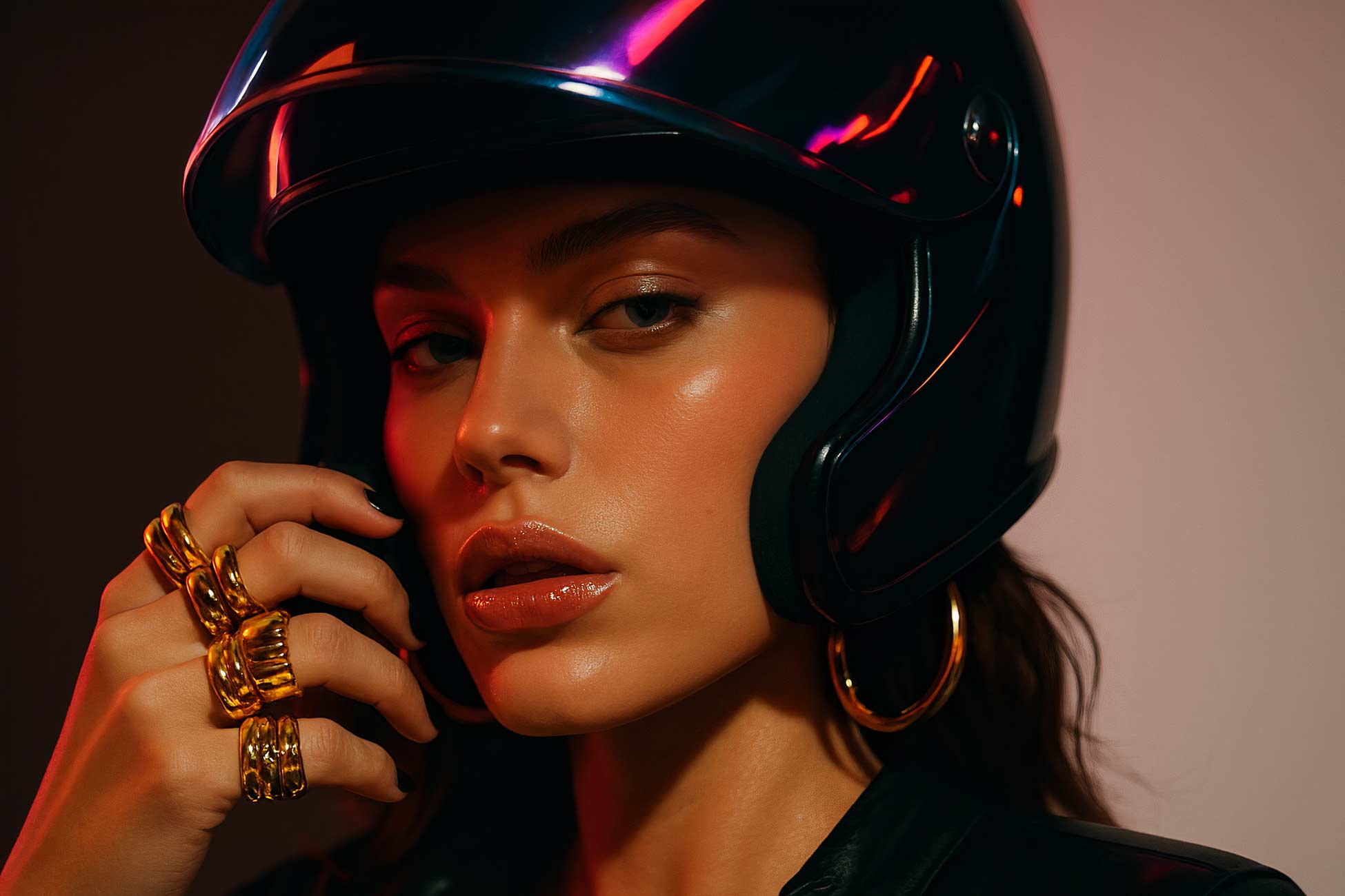 Fashion model in leather jacket with stylish makeup and earrings